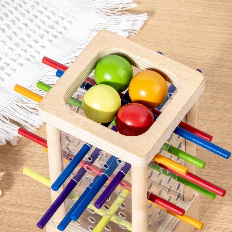 Montessori-kogeltoren met gekleurde staafjes